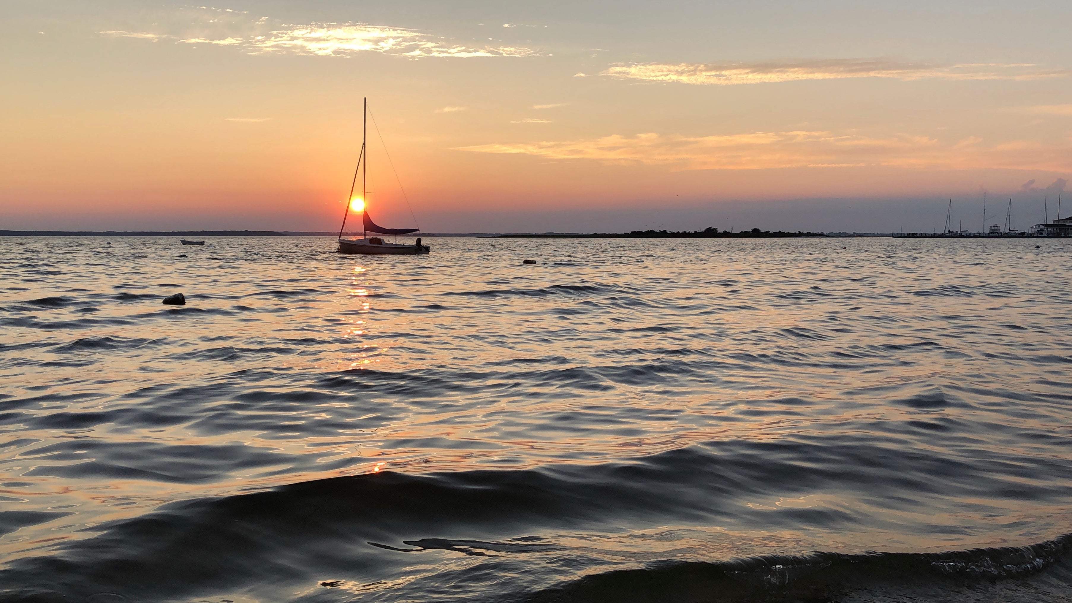 Sailboat on the water at sunset